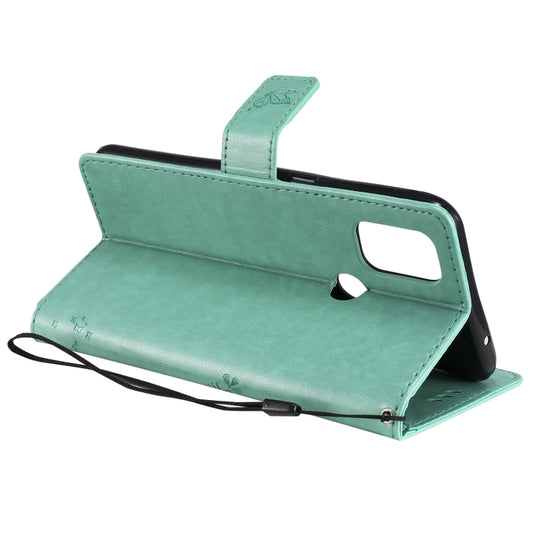 Detailed view of embossed tree and feline motif on premium PU leather surface