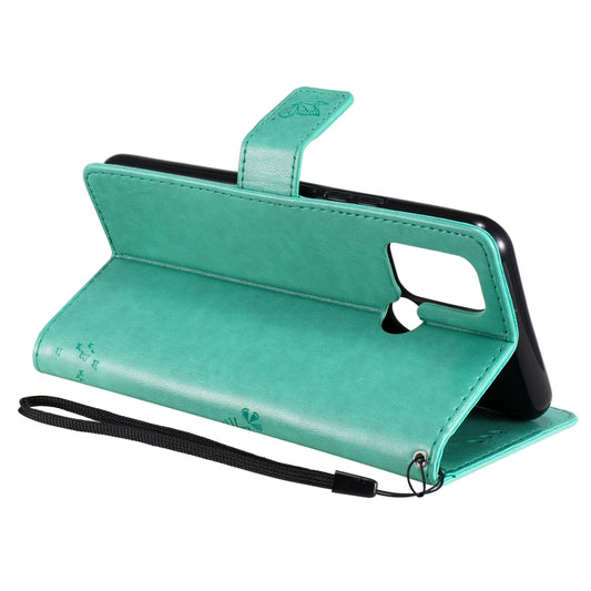 Wallet-style protective cover with printed forest and feline design details
