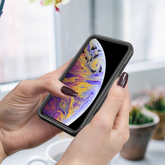 Protective iPhone XS Max case featuring raised edges and button covers