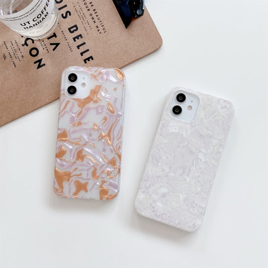 Raised bezel protection on iPhone 11 Pro case featuring tactile shell pattern