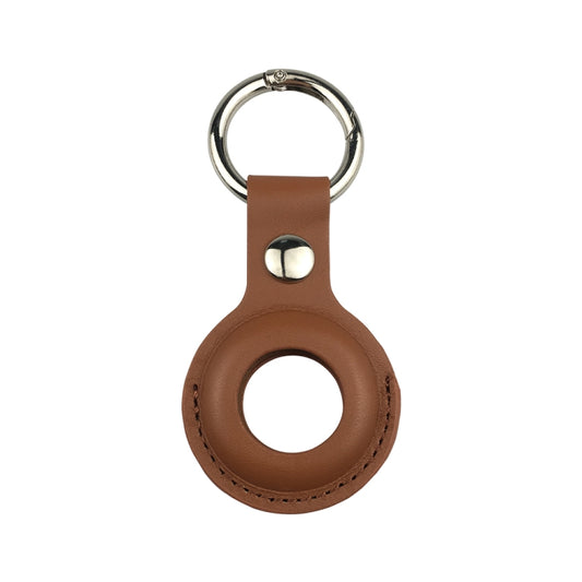 Leather AirTag case hanging from keyring demonstrating practical everyday use