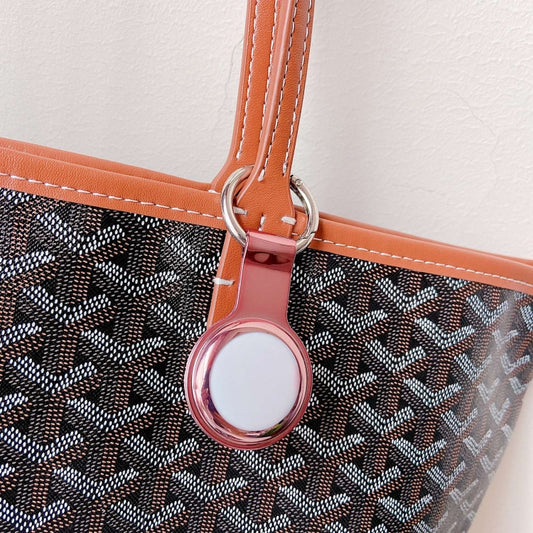 Close-up of premium plating detail on AirTag protective sleeve, slim TPU design