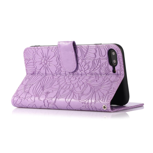 Embossed sunflower pattern detail on premium leather iPhone case with holder stand