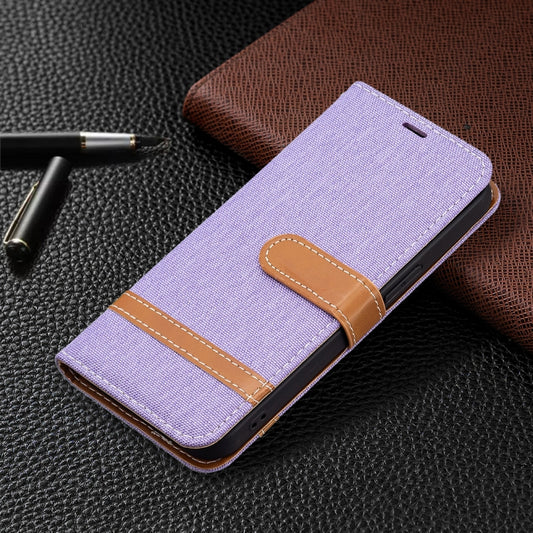 iPhone 13 mini case back panel displaying denim texture and lanyard attachment point