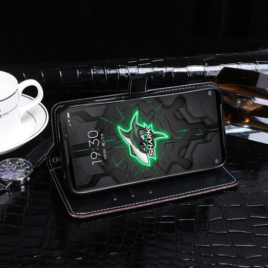 Crocodile textured leather case open showing card slots and cash pocket detail