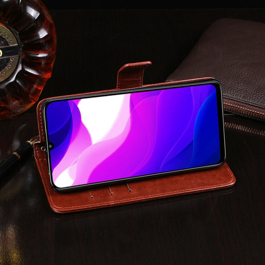 Xiaomi Mi 10 Lite in brown leather case displaying stand holder function