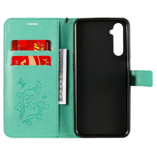 Close-up of raised 3D butterfly embossing texture on leather case surface