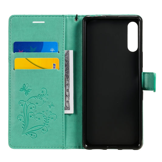 Side profile leather case showing embossed butterfly texture and thickness