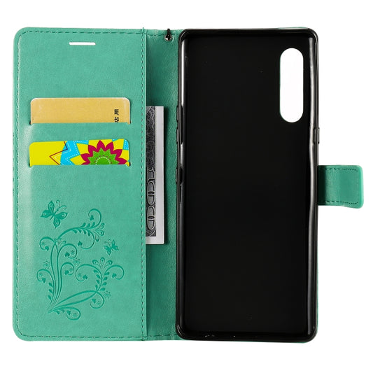 Interior card slots and cash pocket in butterfly embossed iPhone 12 mini flip case