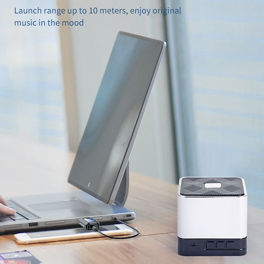 Compact USB Bluetooth 5.0 adapter displaying LCD status screen and indicators