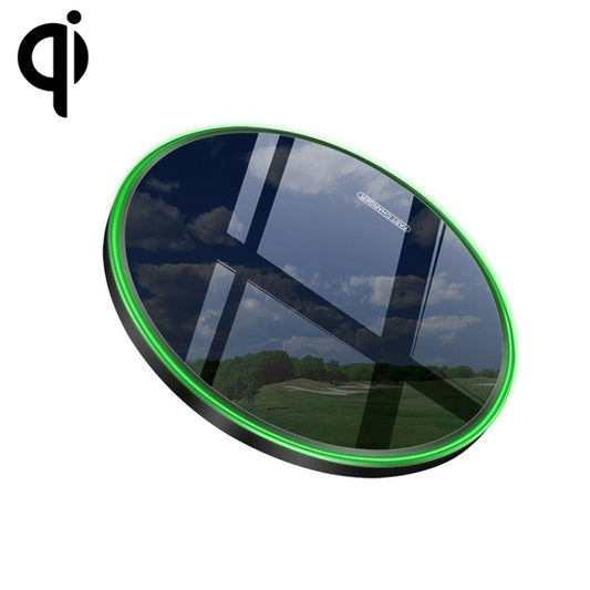 Close-up of metal wireless charger showing smooth round surface and power indicator