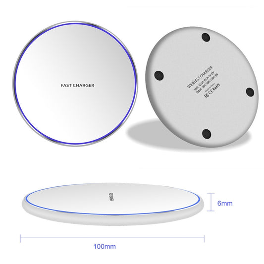 Wireless charging pad in use with smartphone centered on metal round charging surface