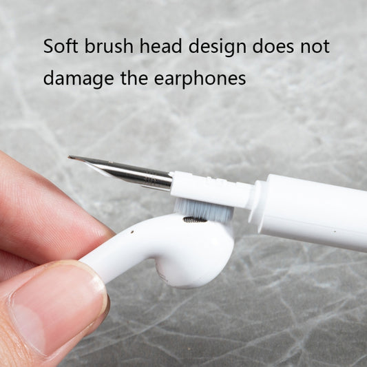 Compact cleaning pen fitting easily in pocket next to wireless earbuds for on-the-go maintenance
