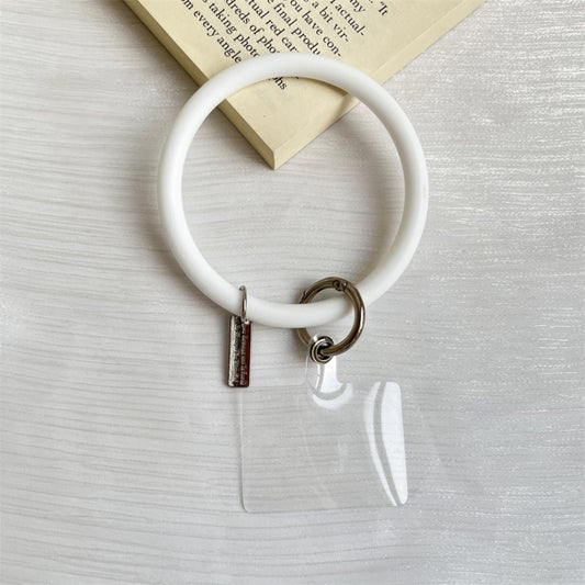 Close-up of silicone bracelet phone lanyard showing textured grip surface and reinforced attachment ring