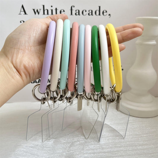 Vibrant color variety of silicone phone lanyards arranged showing all nine available color options