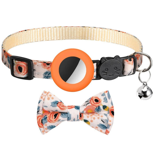 Pink AirTag cat and dog collar with printed pattern, bell, and bow design detail