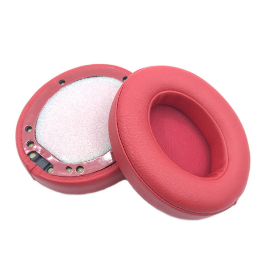 White leather headphone pads with breathable material for extended wear comfort