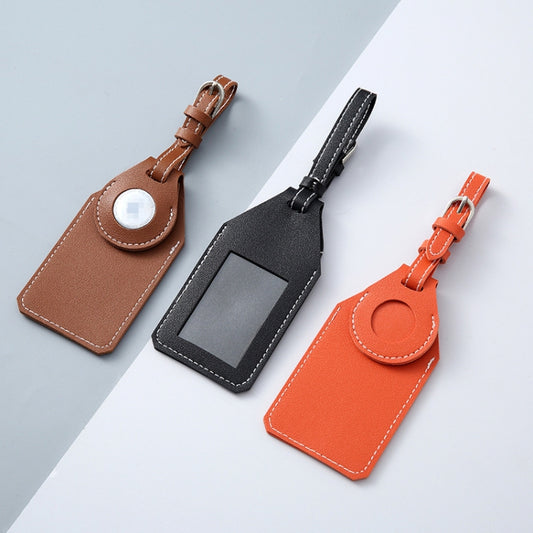 Sleek luggage tag tracker cover attached to suitcase handle, practical travel accessory