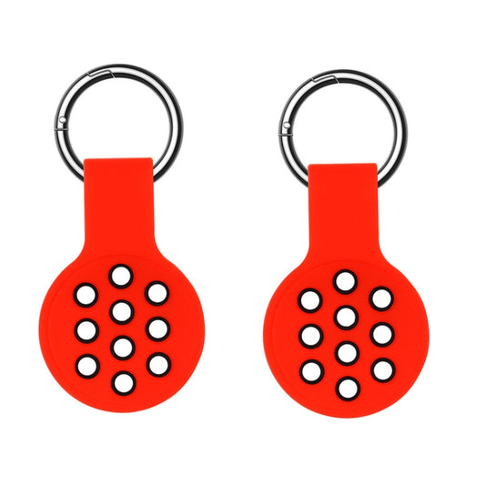 Perforated silicone AirTag cover showing grip texture and ventilation holes