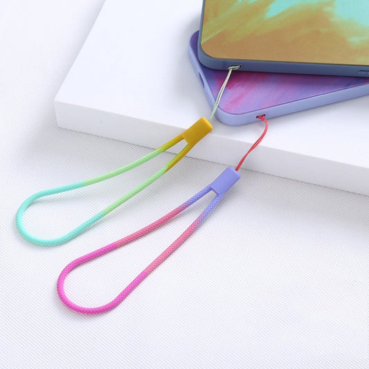 Colorful seasonal silicone lanyards in use, demonstrating how to attach and wear phone straps with watercolor woven details