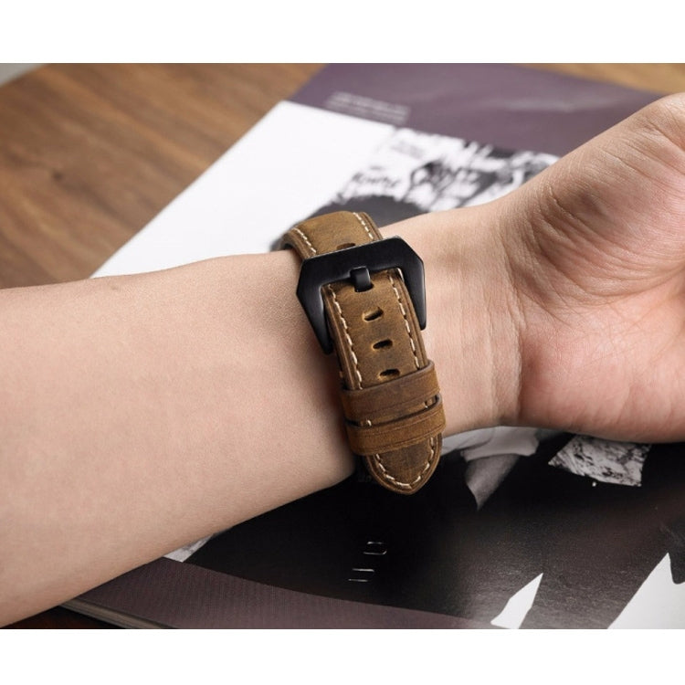 Adjustable black leather watch strap with layered design and secure metal buckle fastening